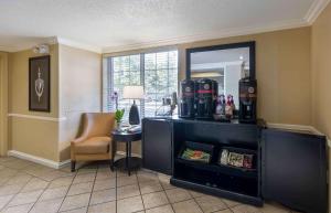 a room with a desk and a chair and a mirror at Extended Stay America Suites - Cleveland - Airport - North Olmsted in North Olmsted