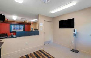 a waiting room with a flat screen tv on a wall at Extended Stay America Suites - Virginia Beach - Independence Blvd in Virginia Beach