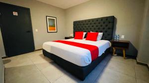 Postel nebo postele na pokoji v ubytování HIT Merida Hotel Boutique + 21 fotografií