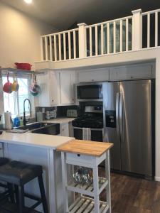 a kitchen with a stainless steel refrigerator and a counter at Margaritaville at River Lodge! Right on the river! 