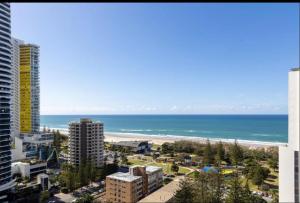a view of the beach and the ocean from a building at Beautiful Ocean View Apartment Signature Broadbeach in Gold Coast