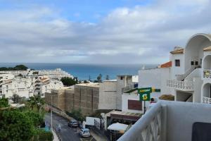 a view of a city with buildings and the ocean at 403 - Oura - 2 bedroom- Sea View in Albufeira