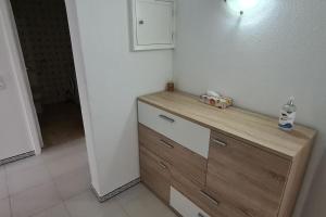 a kitchen with a wooden counter with a bottle of water on it at 403 - Oura - 2 bedroom- Sea View in Albufeira +9 photos