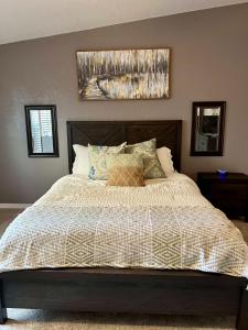 a bedroom with a large bed with at Parker Strip pool house with game room! in Parker