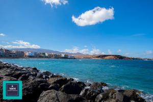 a view of the ocean from a rocky beach at Mara 2 Playa del Burrero junto al mar, wifi gratis in Ingenio