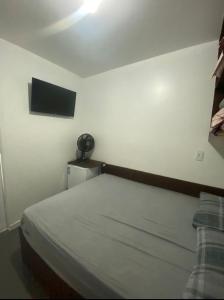 Ein Bett oder Betten in einem Zimmer der Unterkunft Dormitórios ponto 37