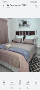 A bed or beds in a room at Ngqamakwe Luxury Guest House and Conference Centre