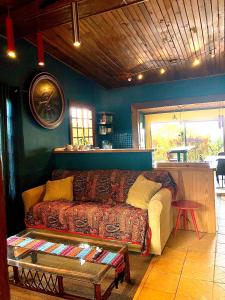 a living room with a couch and a table at Arca de Noe in Valle Hornito