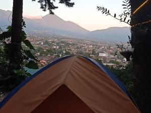 a tent with a view of a city at Glamping ReaVeeCafe Puncak in Puncak