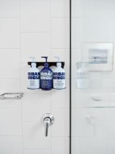 a bathroom door with two bottles of cleaning products on it at Saint Kilda Beach Hotel - formerly Rydges St Kilda in Melbourne