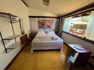 Cama ou camas em um quarto em Pousada Villa Nina