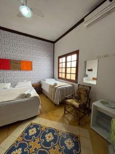 Cama ou camas em um quarto em Pousada Villa Nina