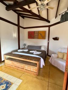 Cama ou camas em um quarto em Pousada Villa Nina