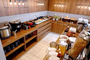 a kitchen with a counter with food on it at Travelodge Sapporo Susukino in Sapporo