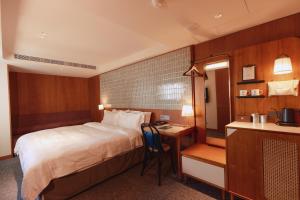 Кровать или кровати в номере 天下南隅 Provintia Hotel