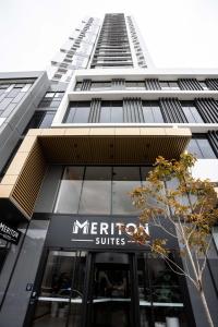 a building with a meridian suites sign in front of it at Meriton Suites Liverpool in Liverpool