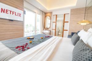 A bed or beds in a room at Aleva Villa Seminyak by Ini Vie Hospitality