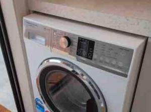 a washer and dryer in a room at New Studio in Te Anau