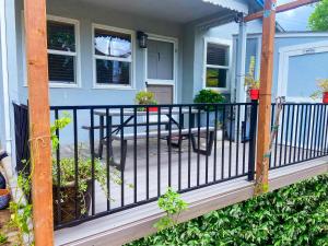 a porch with a black railing on a house at Private House in Sacramento. Only 2mins to Freeway! in Sacramento