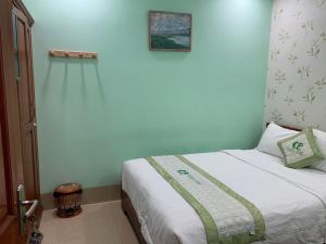 Llit o llits en una habitació de Green Park Hotel Quy Nhon