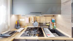 A kitchen or kitchenette at Silver Zsóry Apartman