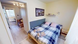 A bed or beds in a room at Silver Zsóry Apartman Még 37 kép
