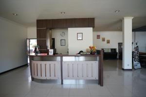a kitchen with a counter in a room at Hotel Puri Pangalengan in Bandung
