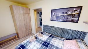 A bed or beds in a room at Silver Zsóry Apartman