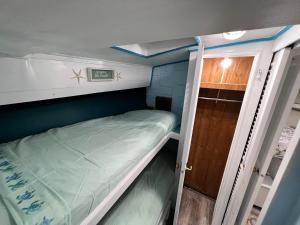 a small room with a bunk bed in it at Beautiful Floating Stay in Marathon