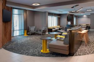 a lobby with a waiting room with couches and tables at SpringHill Suites by Marriott Portland Hillsboro in Hillsboro