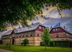 a large building with a rainbow in the sky at Bernstorff Castle Hotel in Gentofte