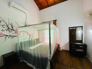Posteľ alebo postele v izbe v ubytovaní Sunrise Cabanas