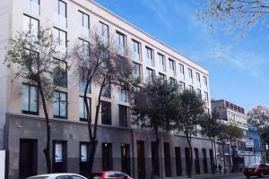 a large white building with trees in front of it at Secure, central and quiet apartment work or travel in Mexico City