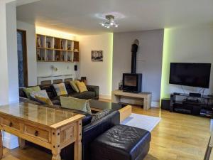 a living room with a couch and a table at Detached 4 Bedroom Luxury Home in Halifax