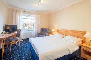 Postel nebo postele na pokoji v ubytování Trip Inn Hotel Astoria
