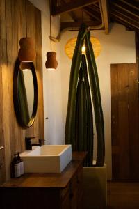 a bathroom with a sink and a mirror at Modjo Apartment Bingin in Uluwatu