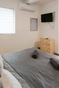 Postel nebo postele na pokoji v ubytování SárvárLAK Apartmanház