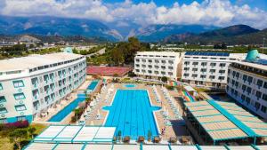 an aerial view of a resort with a swimming pool at Daima Biz Hotel - Dolusu Aquapark Access in Kemer