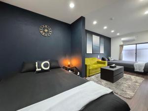 Postel nebo postele na pokoji v ubytování guesthouse Nakatsu