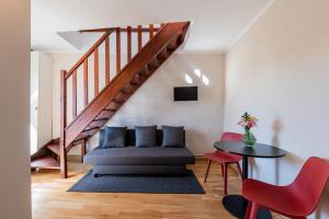 a living room with a couch and a table at SUITE & APART in Berlin
