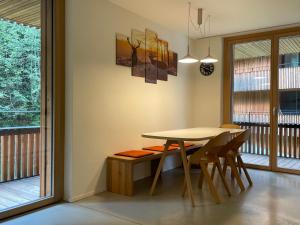 a dining room with a table and chairs at Ferienwohnung 3,5 Zimmer direkt an Ski- und Bikepiste in Flims