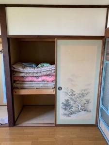 a room with a bunk bed with a door open at 854Annex in Kotaniishi