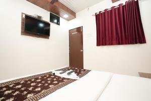 Postelja oz. postelje v sobi nastanitve Hotel Mumbai Residency