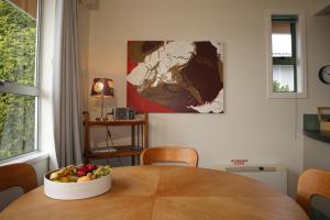 a table with a bowl of fruit on top of it at Spectacular Views, Convenient, Affordable - KK17129 in Kaikoura