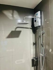 a shower in a bathroom with a shower head at UNIT 4765 AIR in Manila