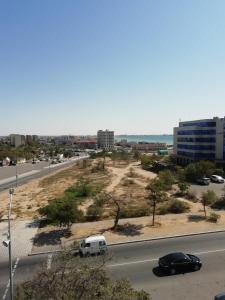 a highway with cars parked on the side of a road at квартира у моря in Aktau