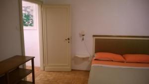 A bed or beds in a room at In Venice Back To San Marco tourist apartment