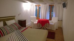 A bed or beds in a room at In Venice Back To San Marco tourist apartment