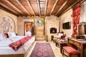 Postel nebo postele na pokoji v ubytování Cappadocia Gamirasu Cave Hotel + 37 fotografií