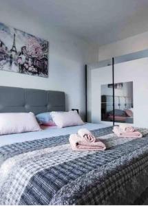 a bedroom with a bed with two towels on it at Apartments Ita - Postira in Postira +103 photos